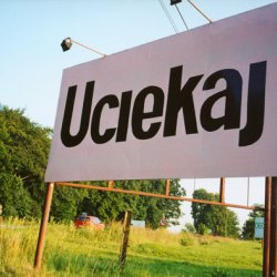 UCIEKAJ, 2003,  billboard na drodze wylotowej z Cieszyna
